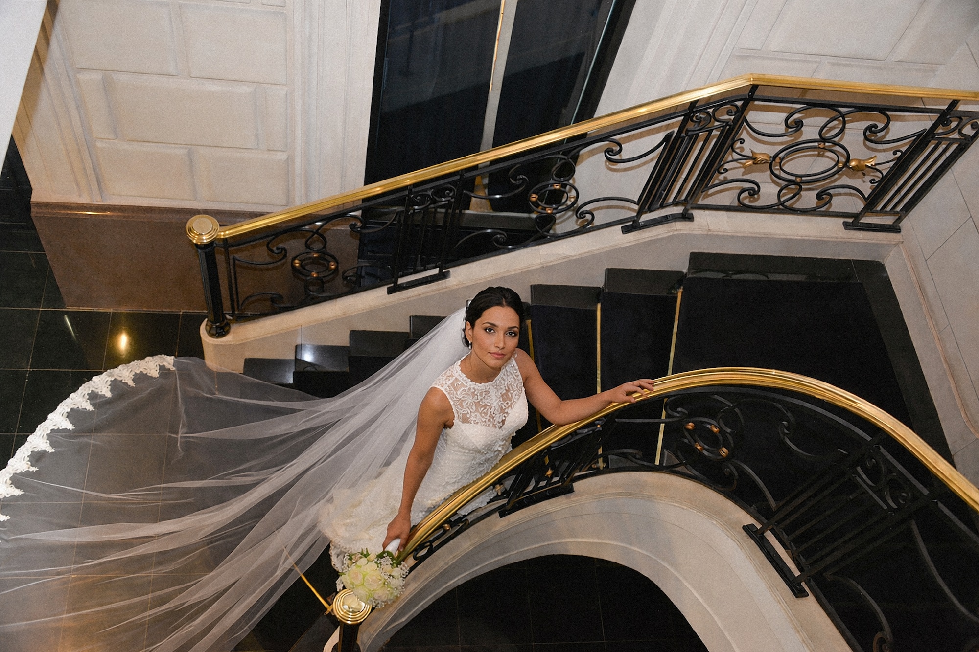 a woman in a wedding dress on a staircase