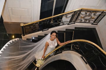 a woman in a wedding dress on a staircase
