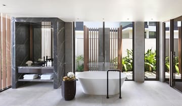 a bathroom with a tub and a tub in it