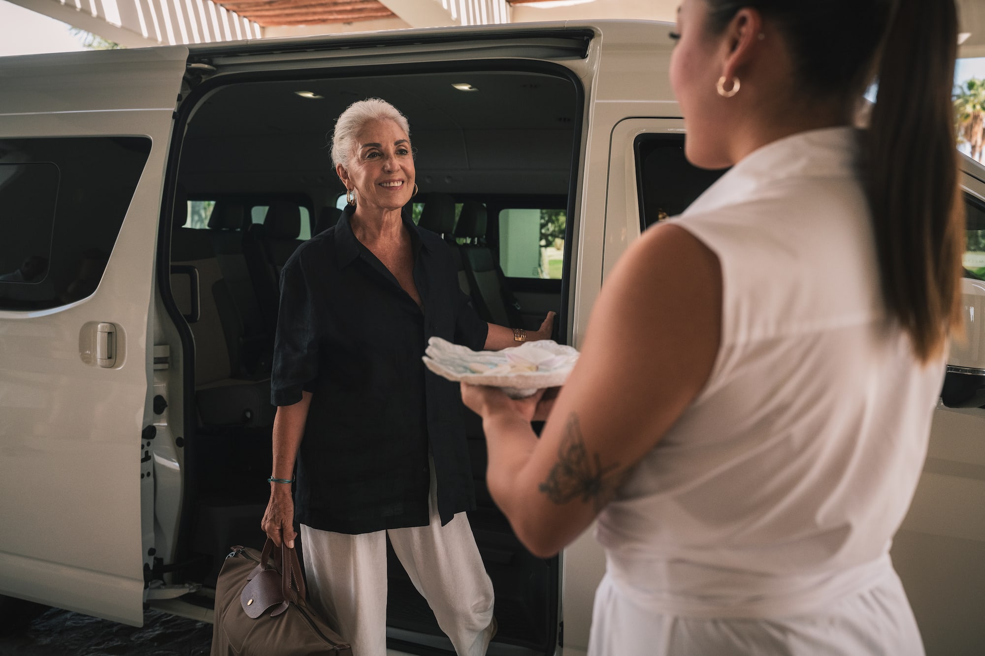 a woman holding a plate of food