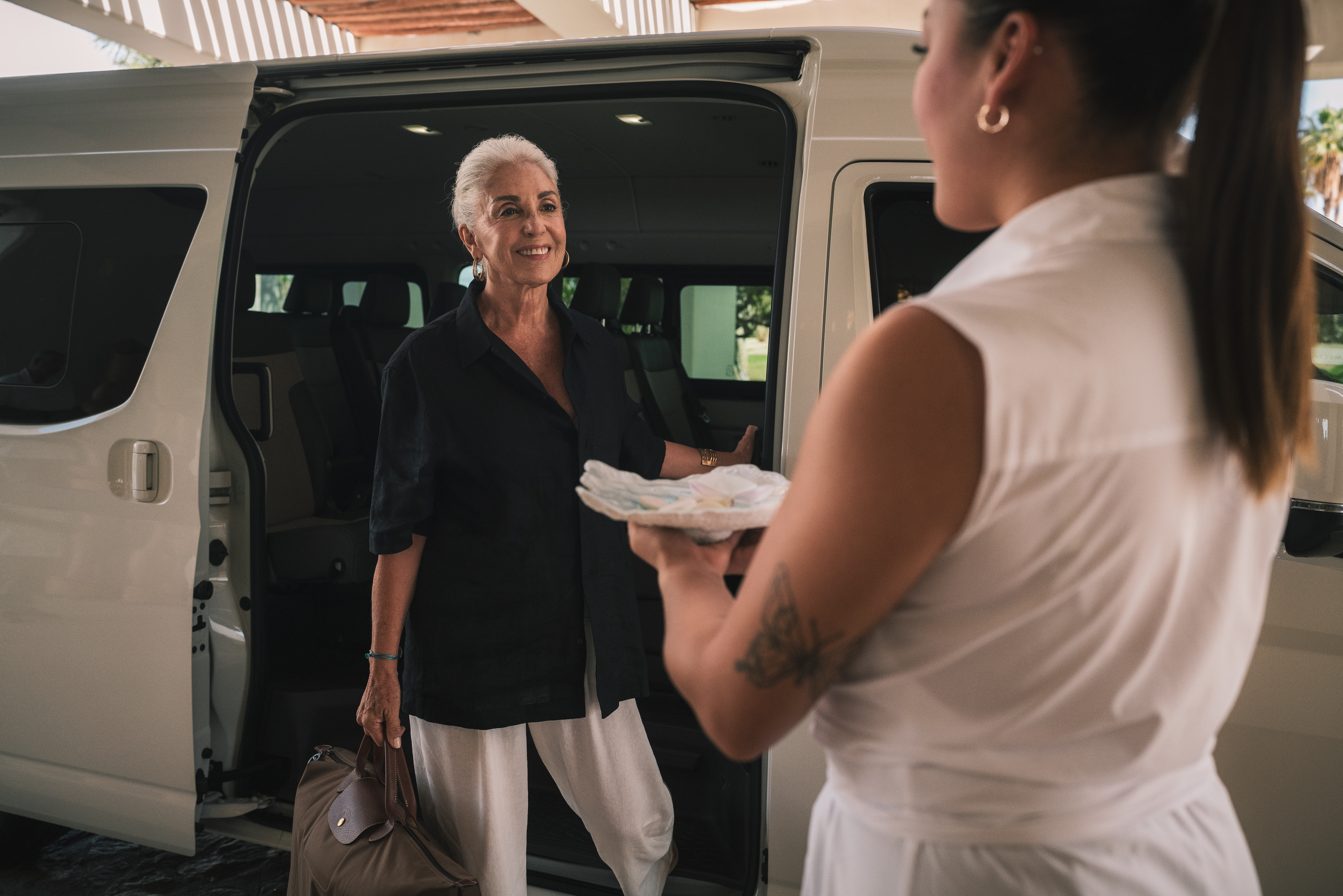 a woman holding a plate of food