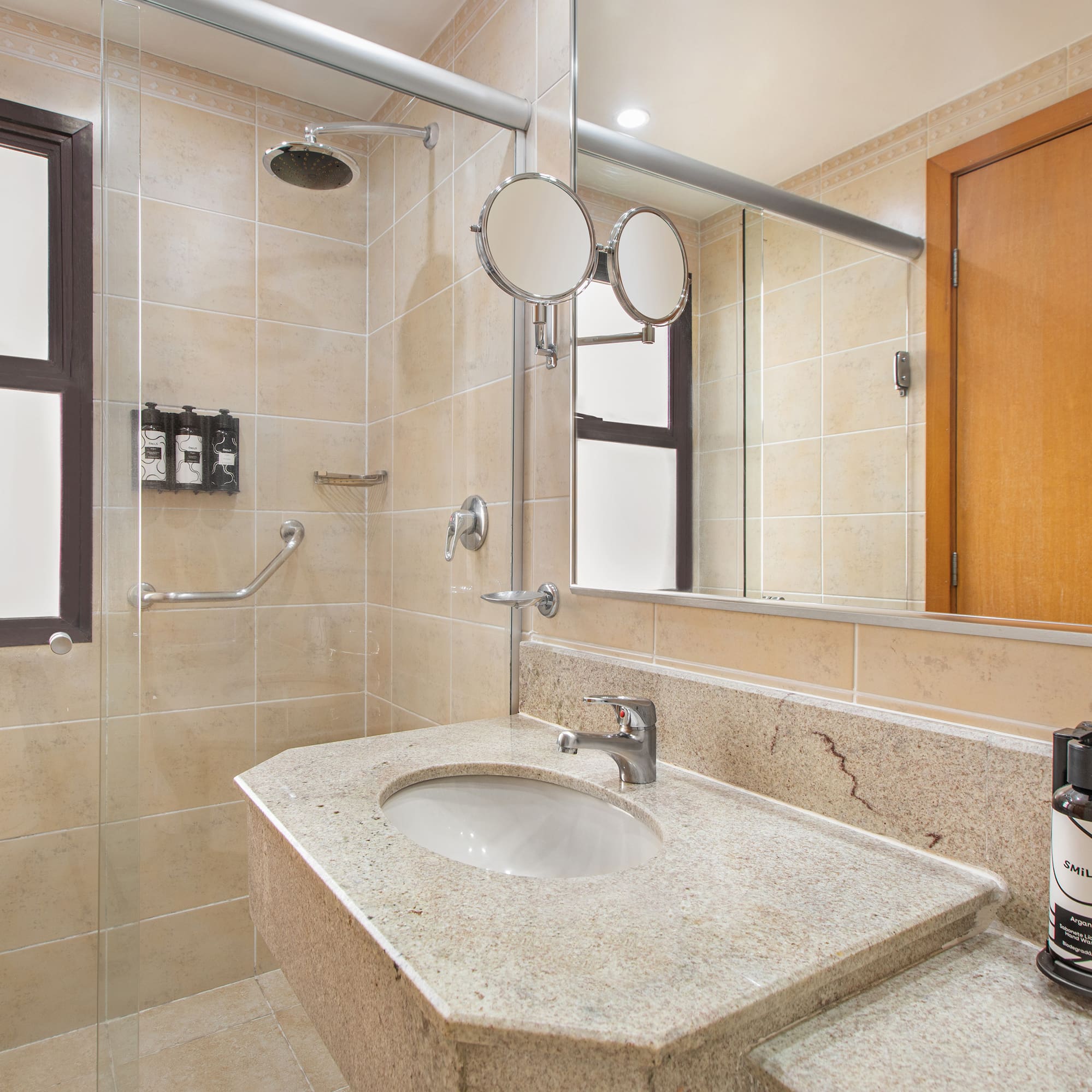 a bathroom with a sink and shower