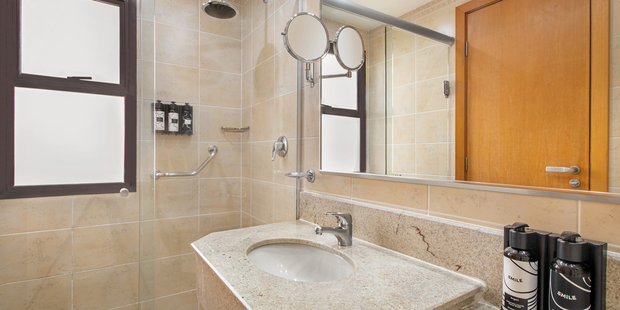 a bathroom with a sink and shower