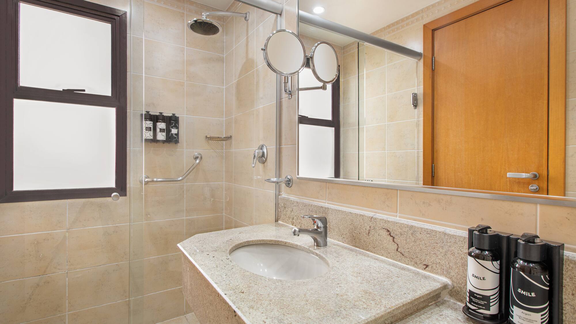 a bathroom with a sink and shower