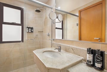 a bathroom with a sink and shower