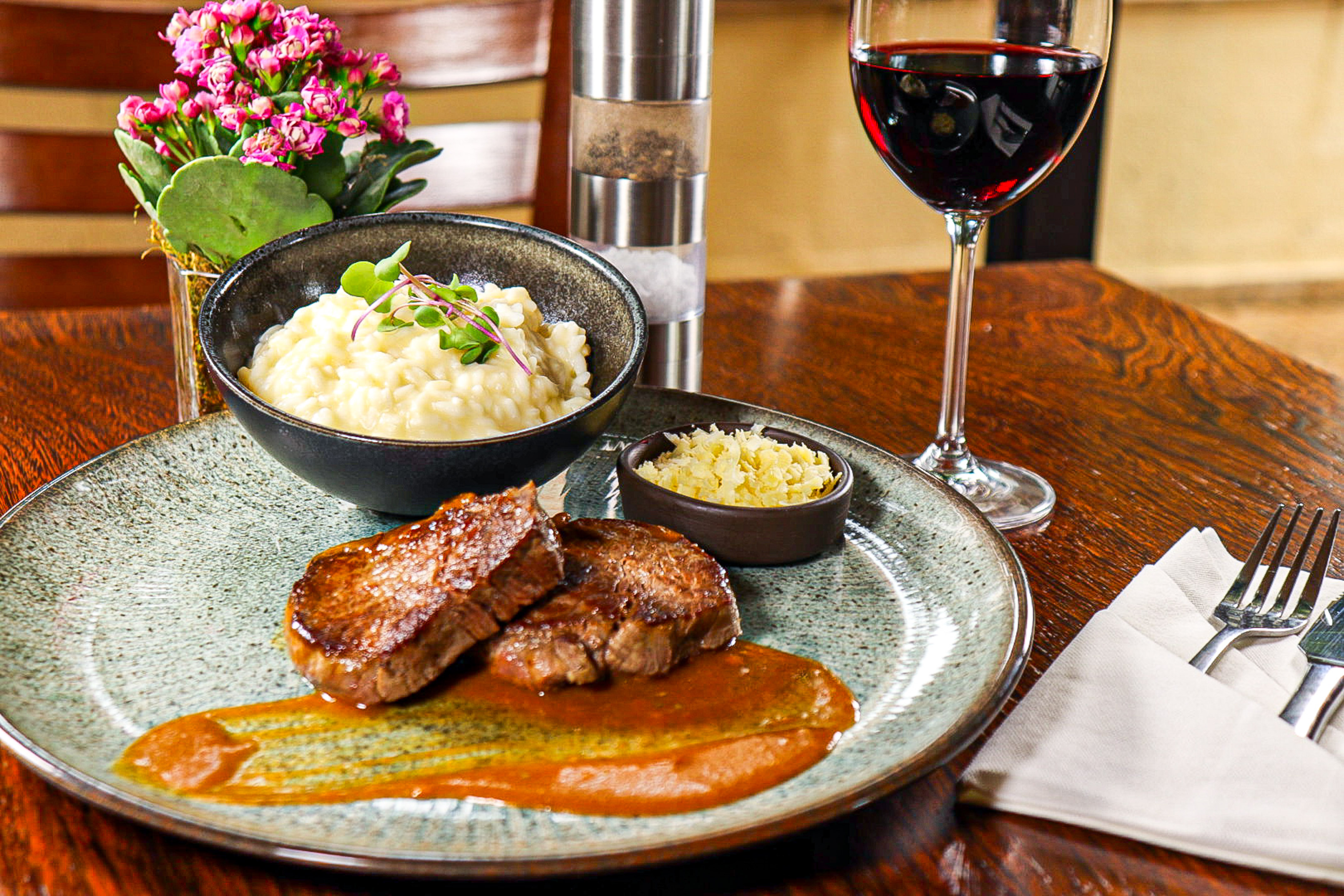 Restaurant meal: Seared steak, creamy risotto, red wine, and cheese.