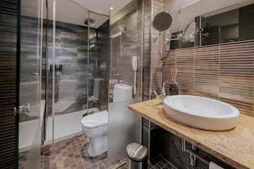 a bathroom with a sink and shower