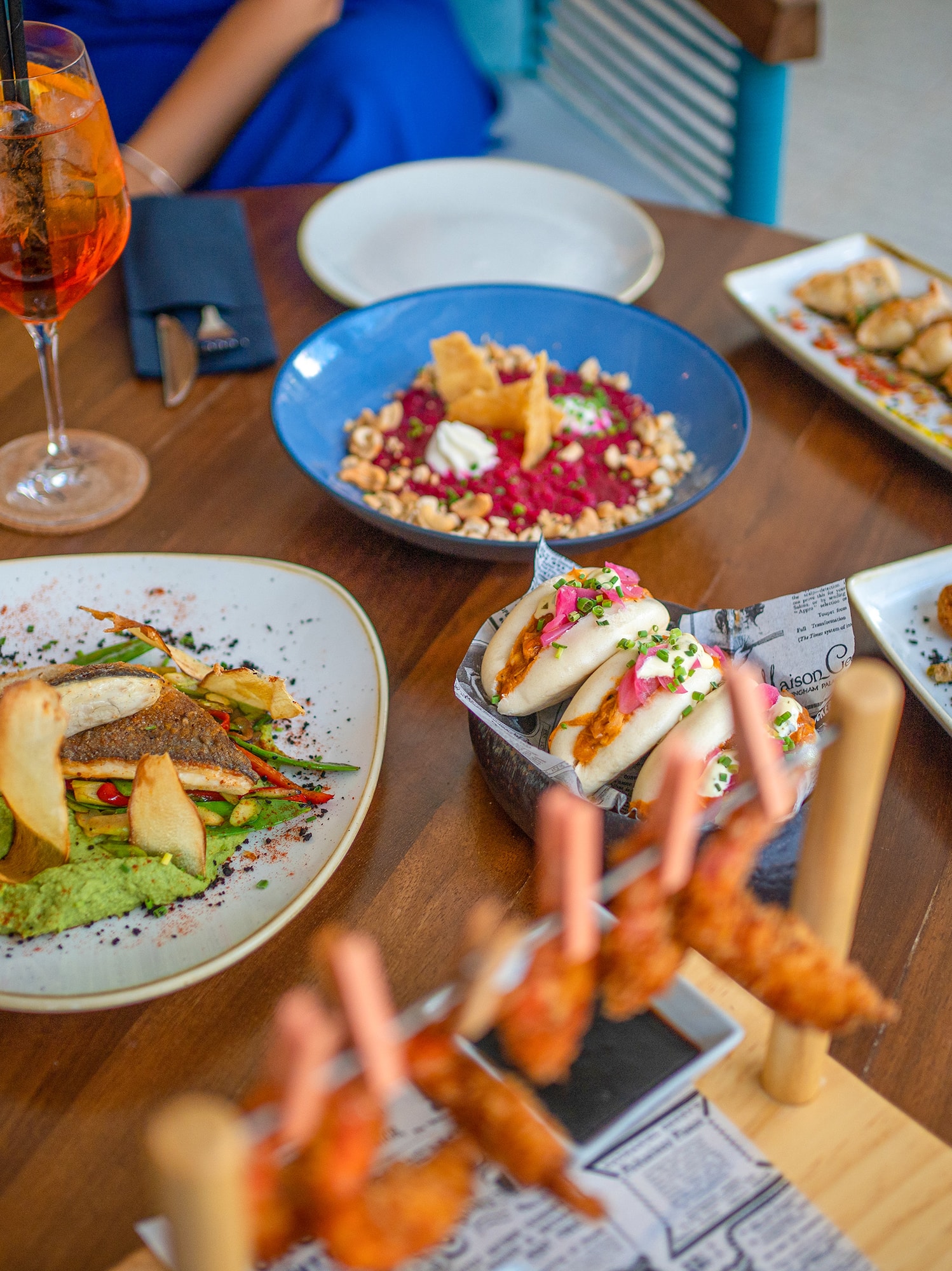 a table with plates of food and drinks