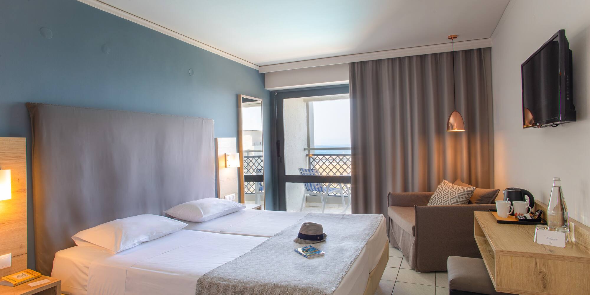 a room with two beds and a table