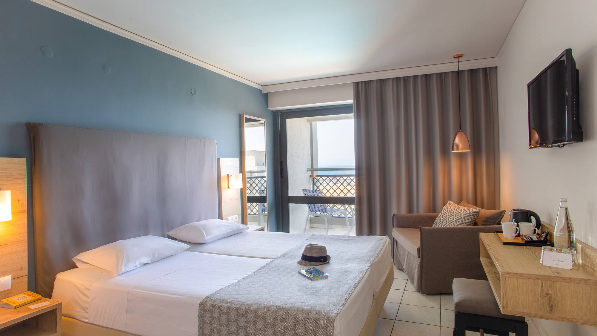 a room with two beds and a table