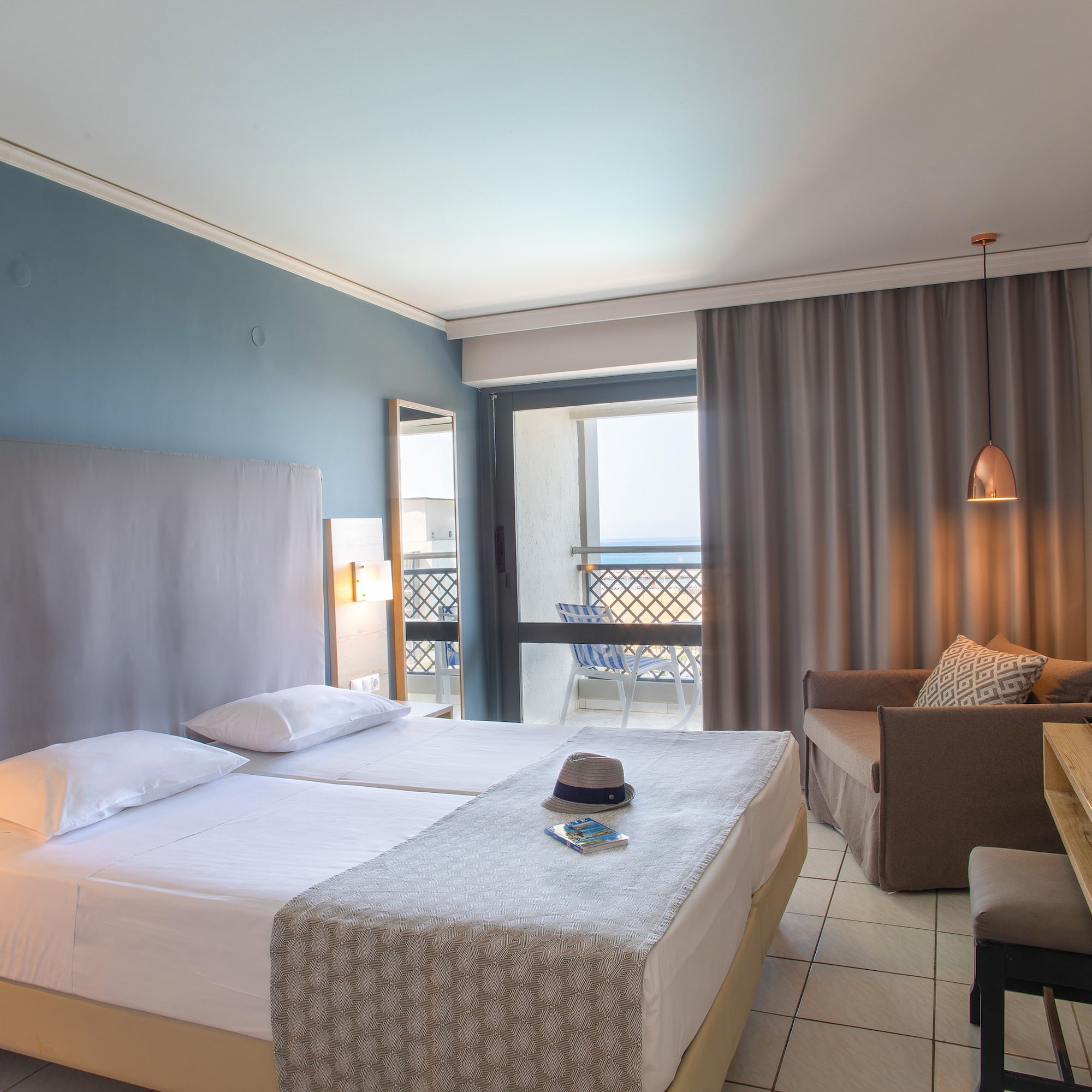 a room with two beds and a table