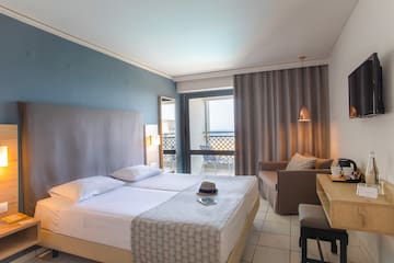 a room with two beds and a table