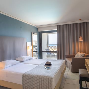 a room with two beds and a table