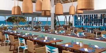 a restaurant with tables and chairs