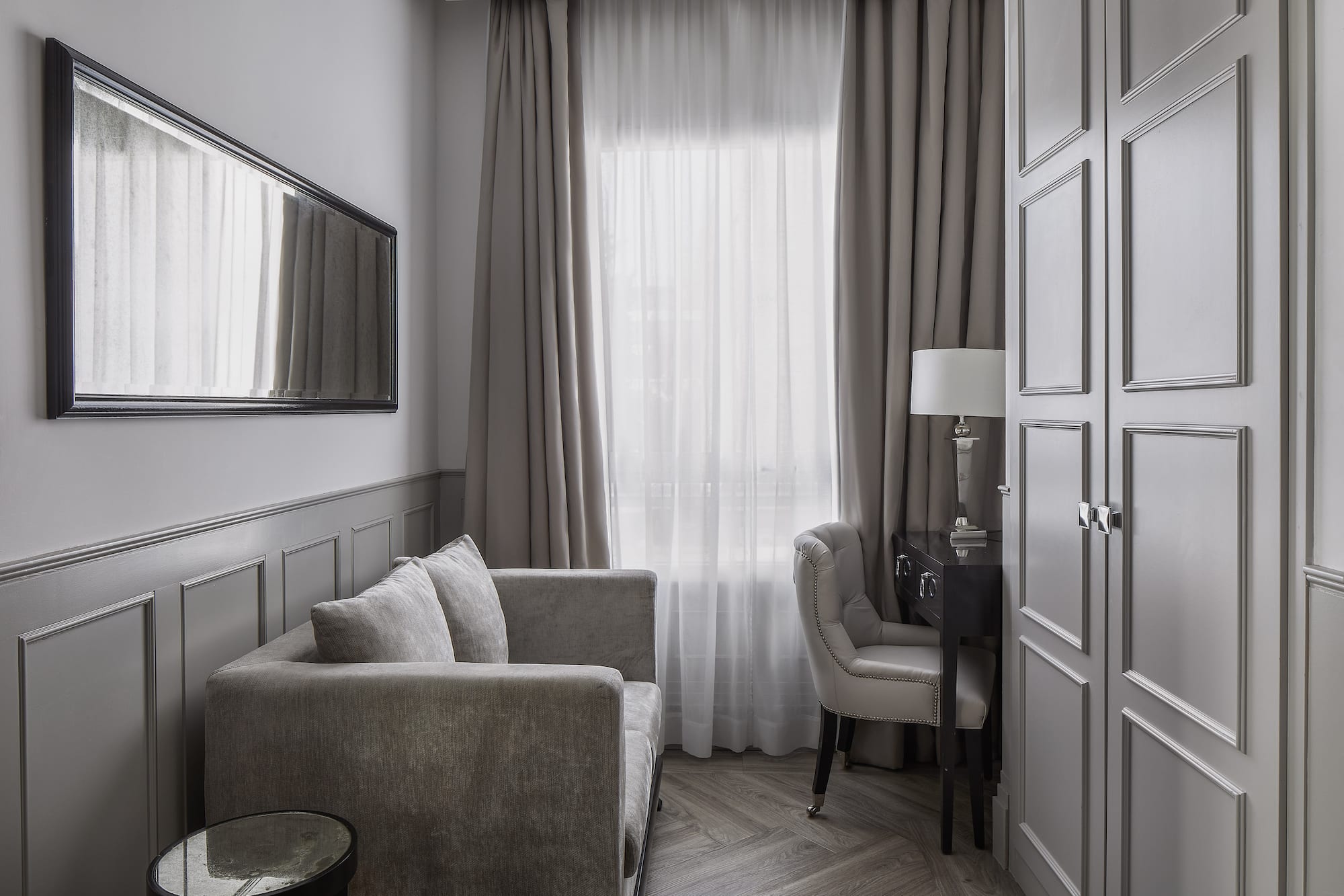 a room with a couch and a mirror