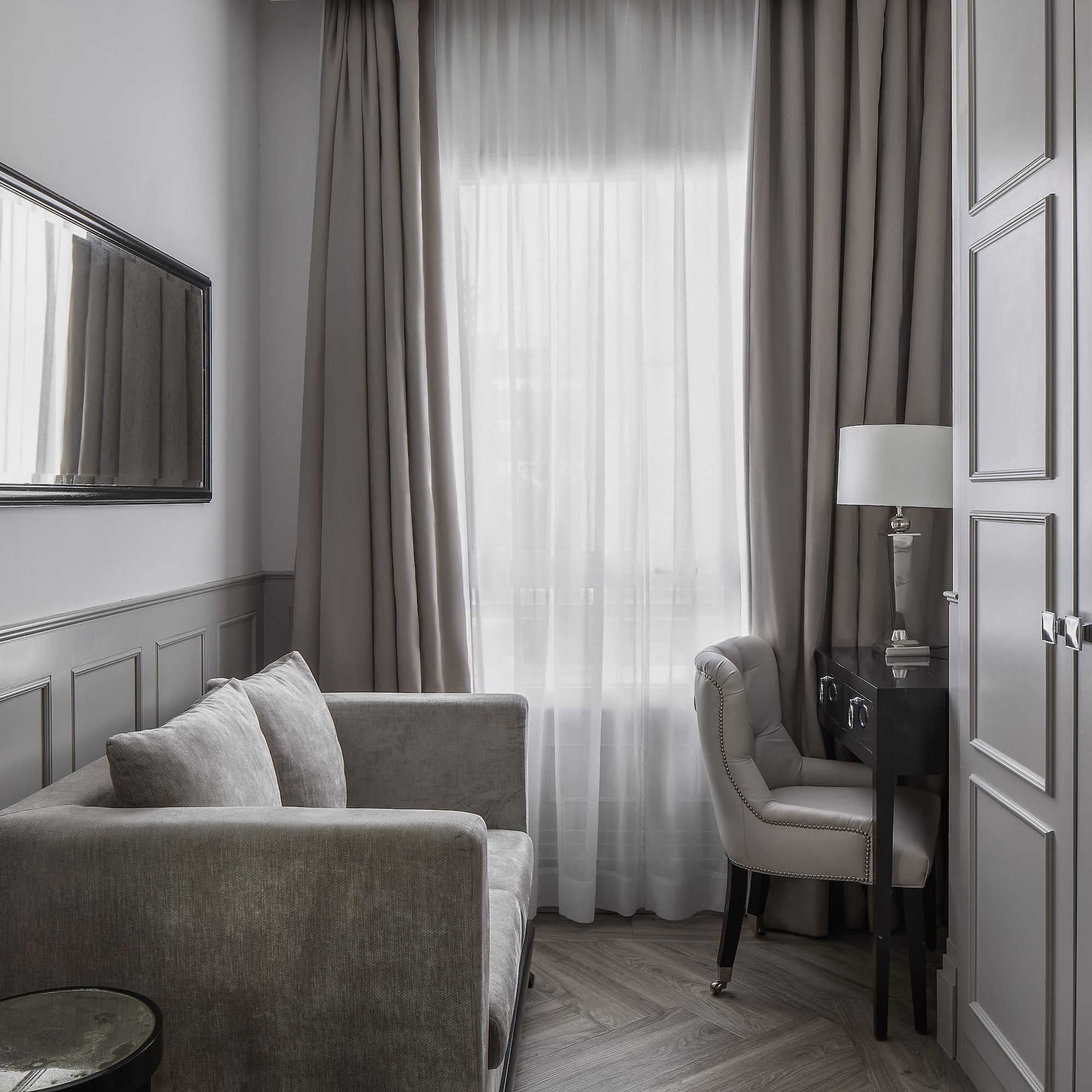 a room with a couch and a mirror