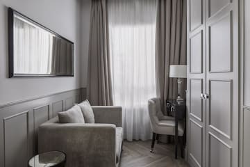 a room with a couch and a mirror