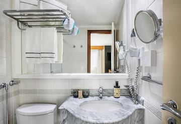 a bathroom with a sink and toilet