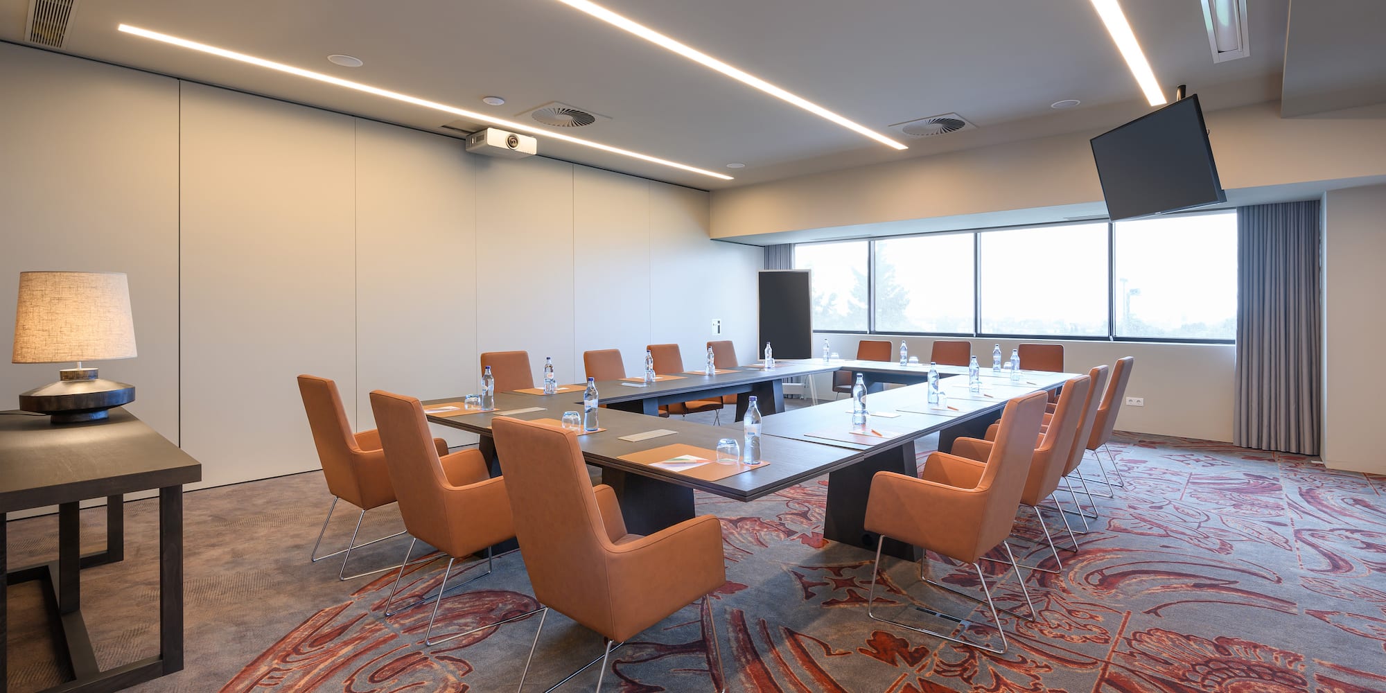 a conference room with a table and chairs