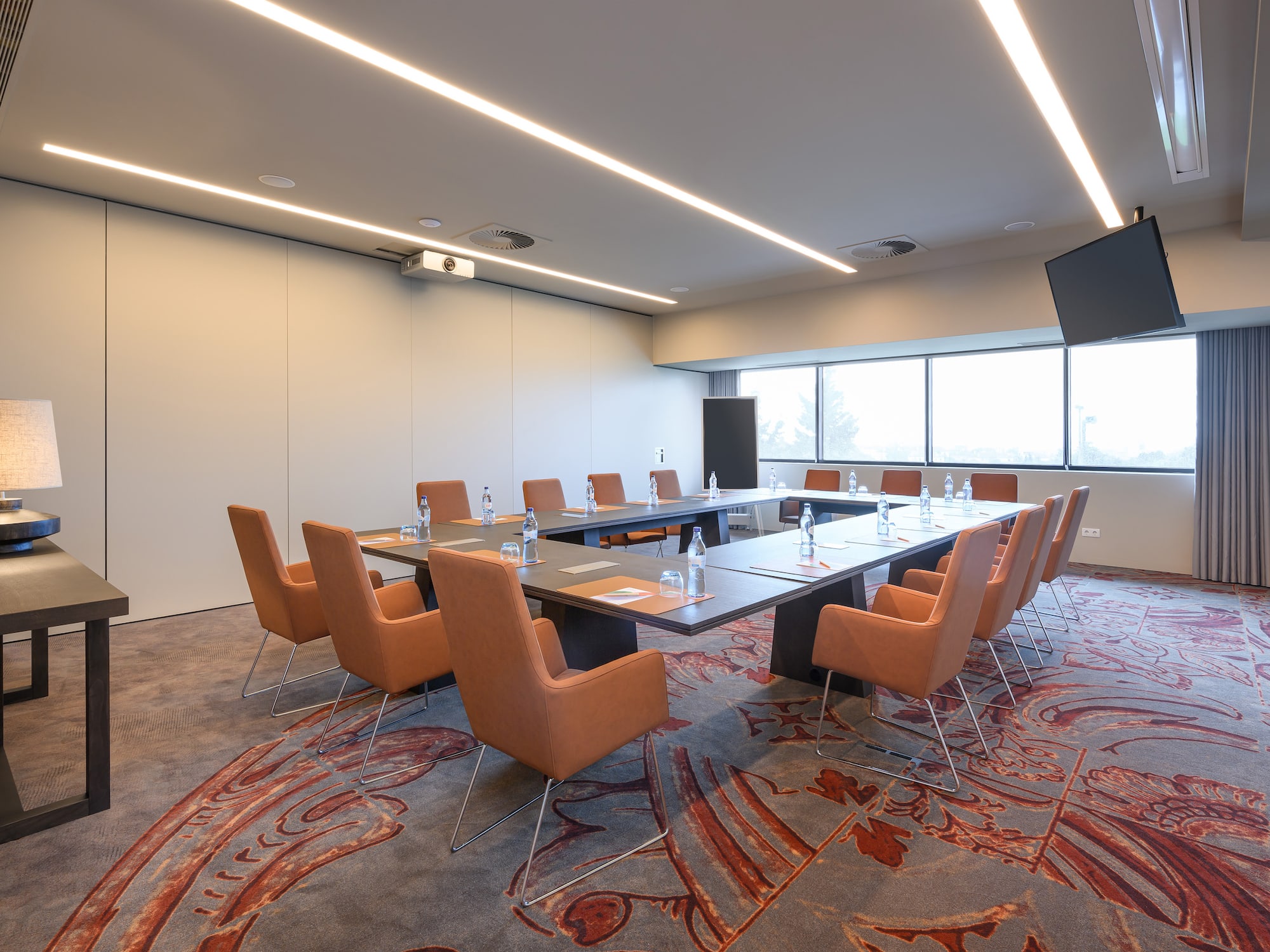 a conference room with a table and chairs