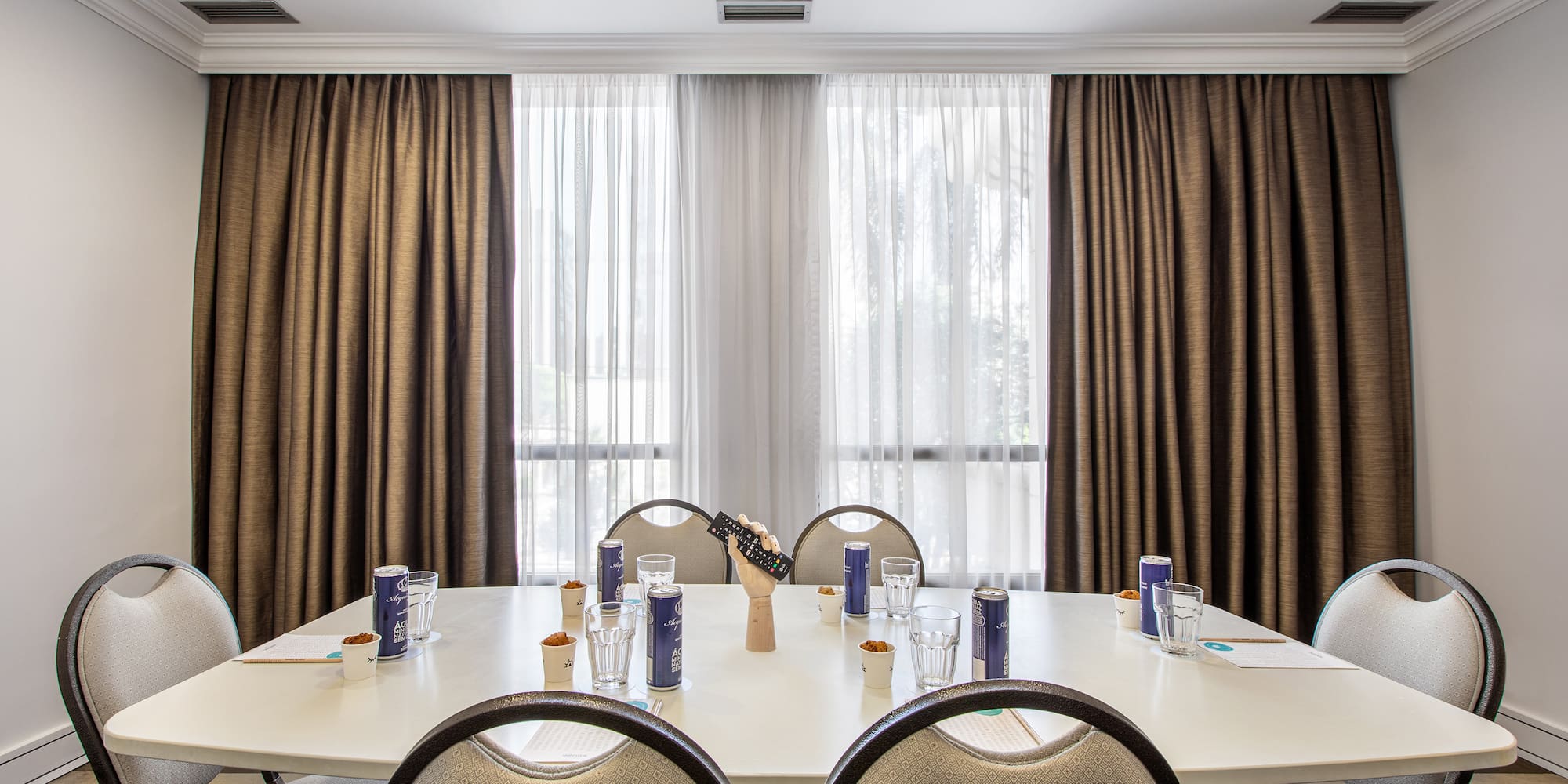 a room with a table and chairs