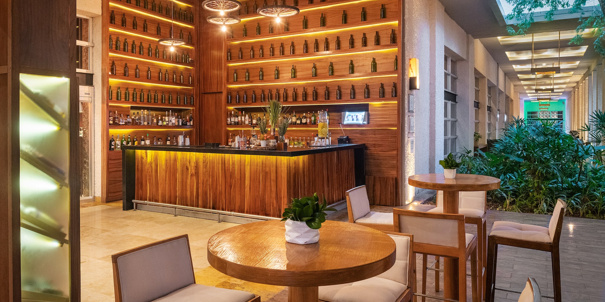 a room with a bar and a table and chairs