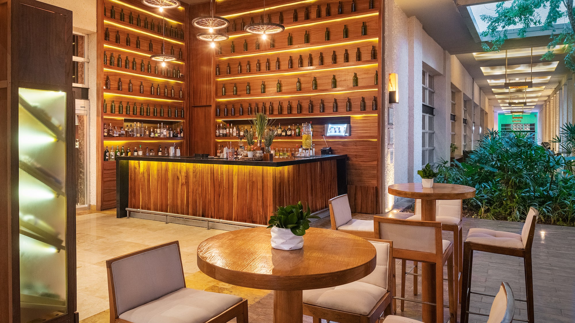 a room with a bar and a table and chairs