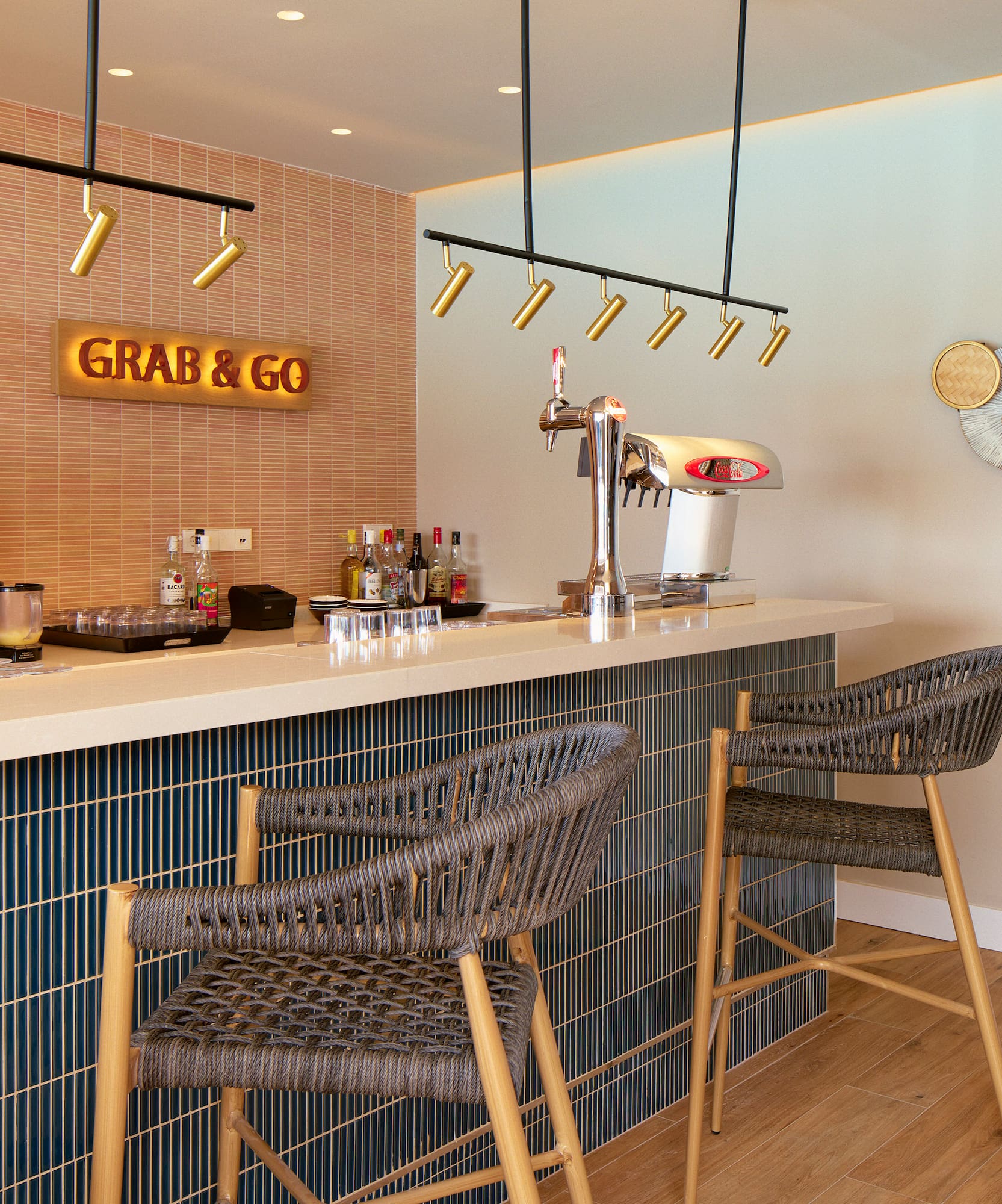 a bar with chairs and a coffee machine