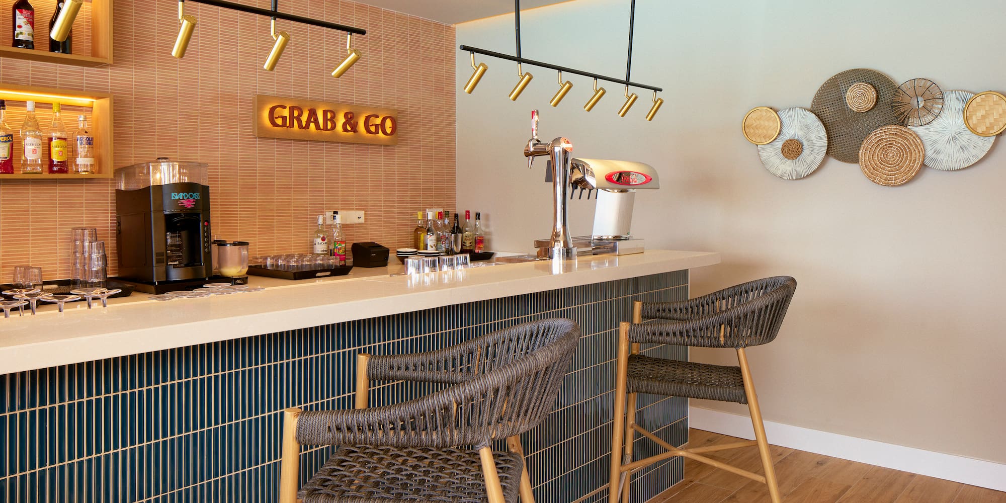 a bar with chairs and a coffee machine