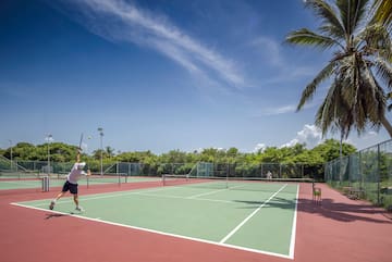a man playing tennis on a tennis court