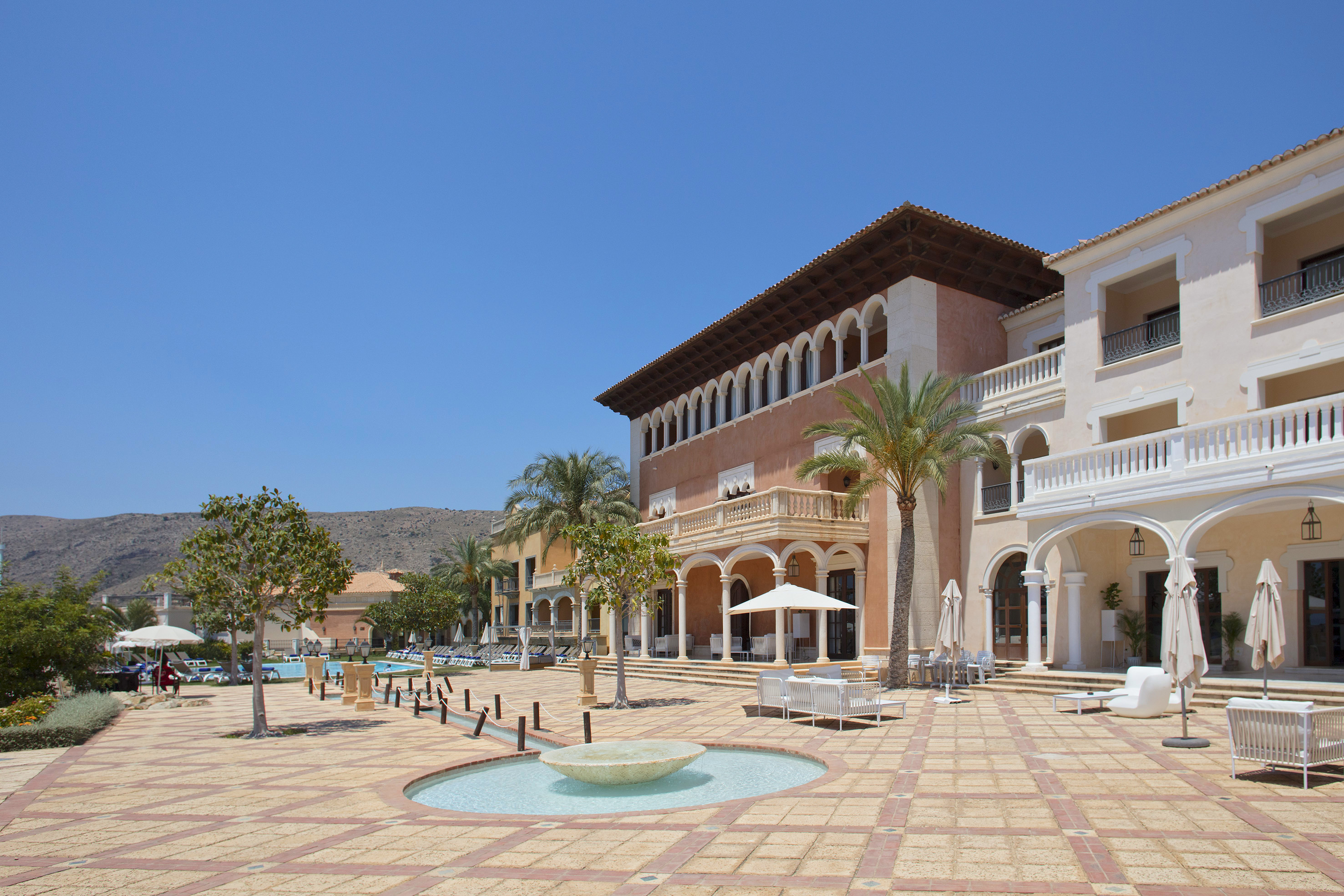 a building with a fountain in front of it