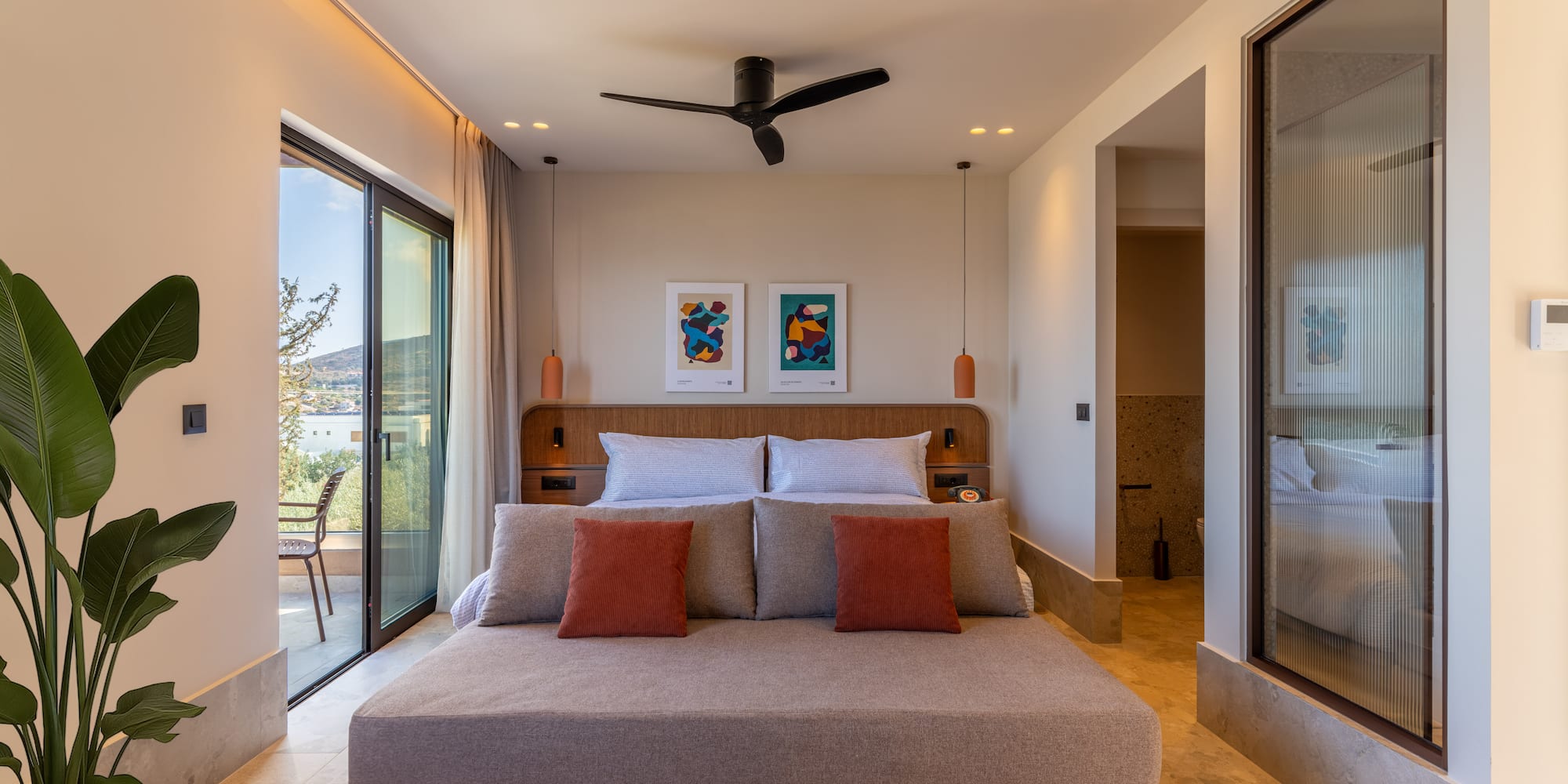 a bedroom with a bed and a ceiling fan