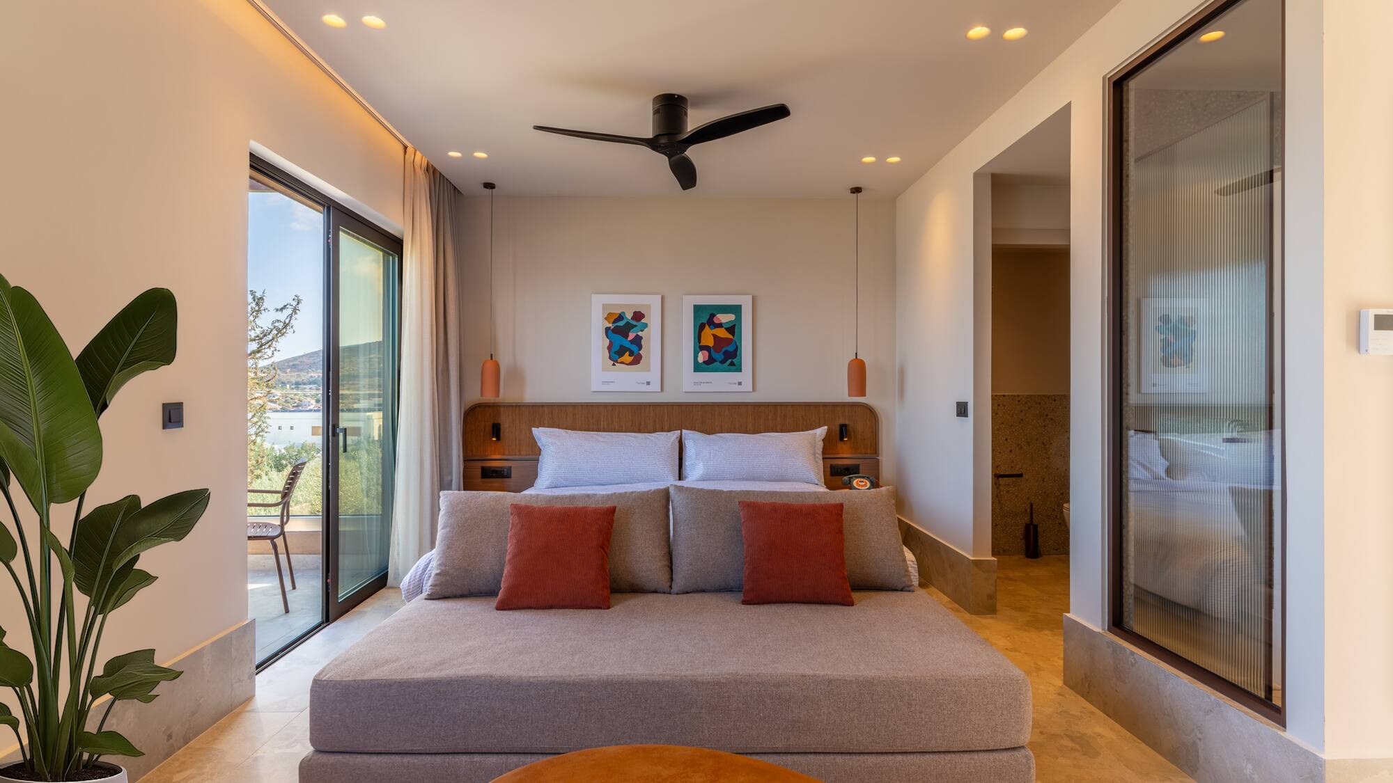 a bedroom with a bed and a ceiling fan
