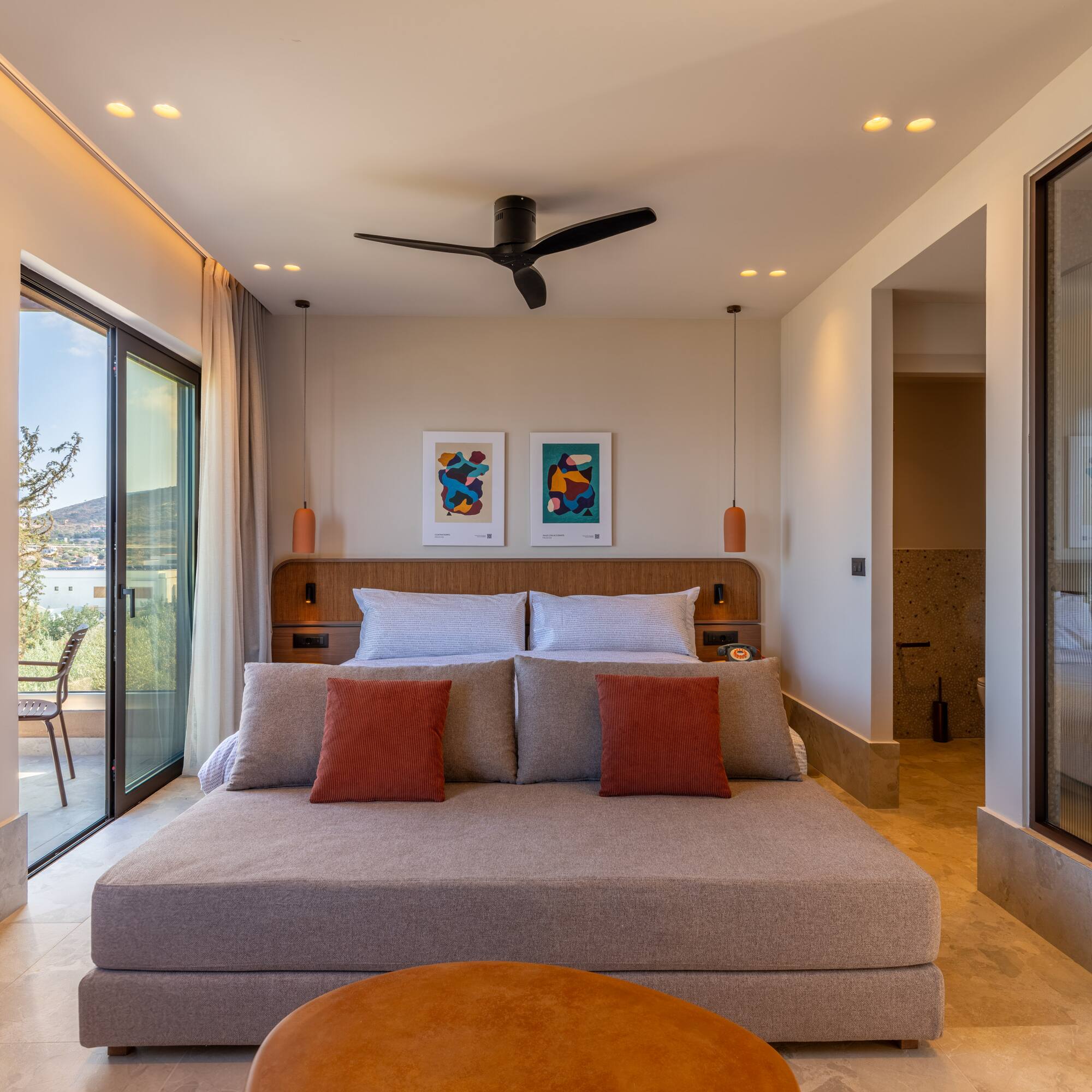 a bedroom with a bed and a ceiling fan