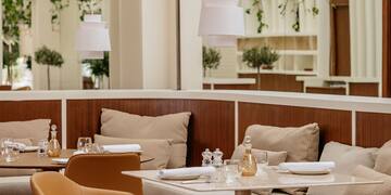 a restaurant with tables and chairs