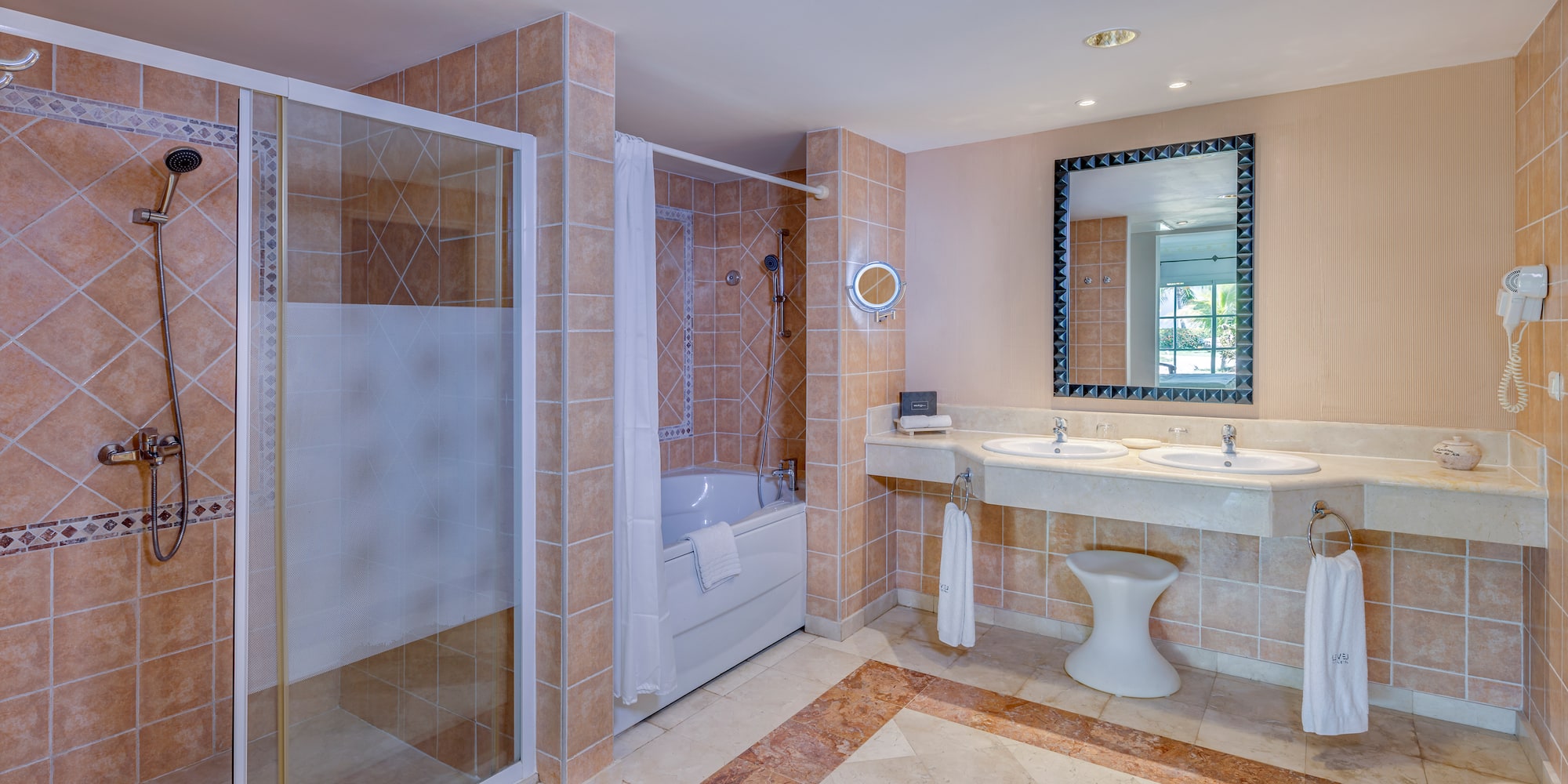 a bathroom with a shower and sink