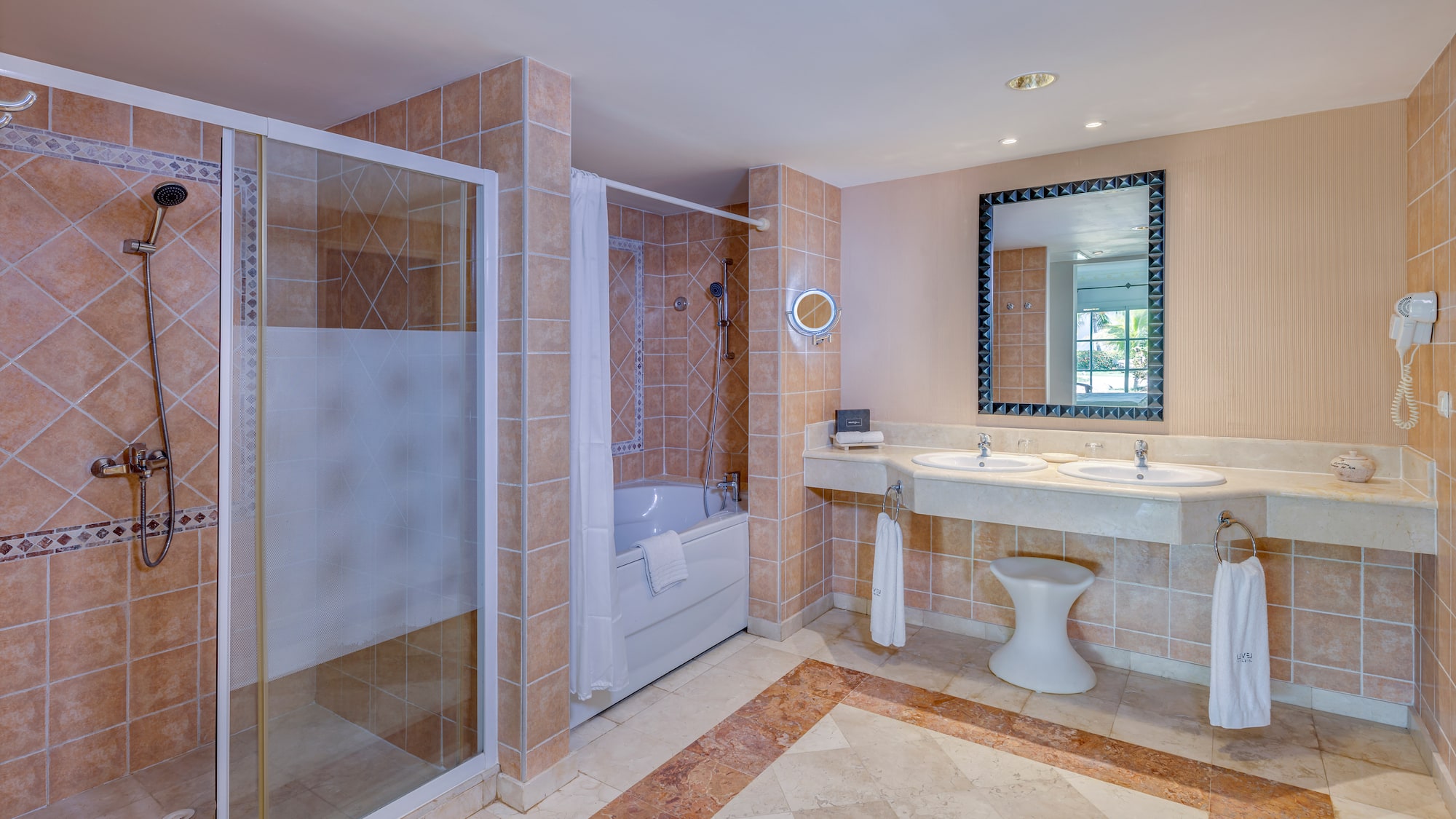 a bathroom with a shower and sink