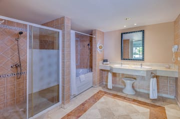 a bathroom with a shower and sink