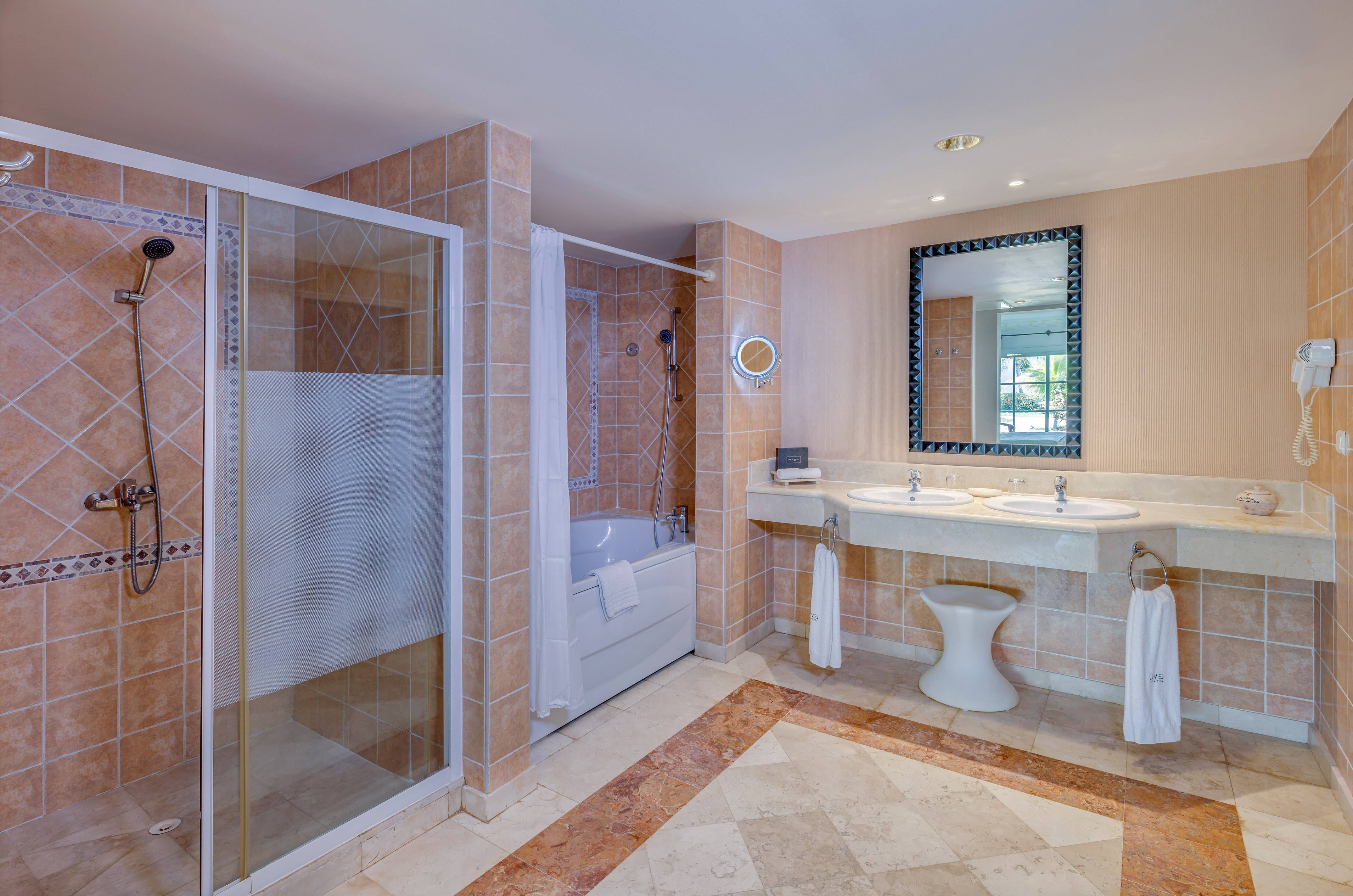 a bathroom with a shower and sink