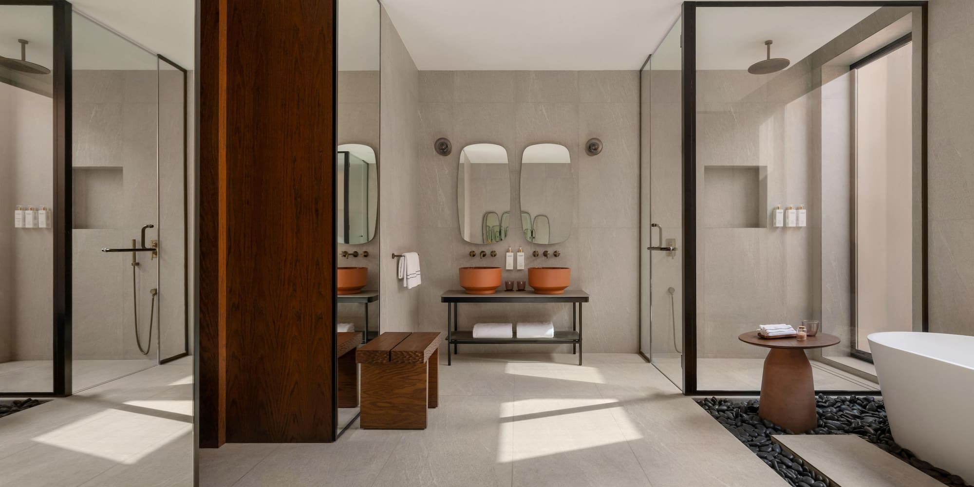 a bathroom with a stone floor and a stone table