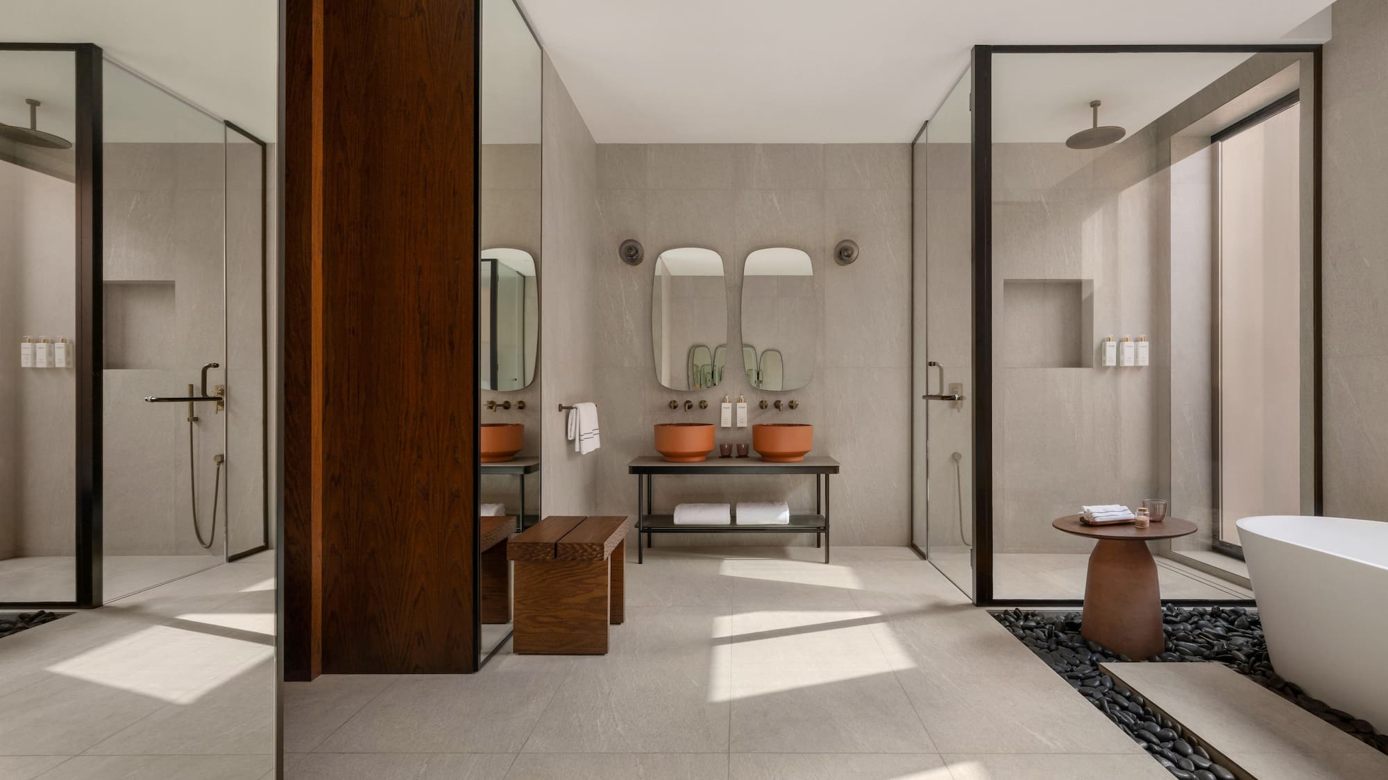 a bathroom with a stone floor and a stone table