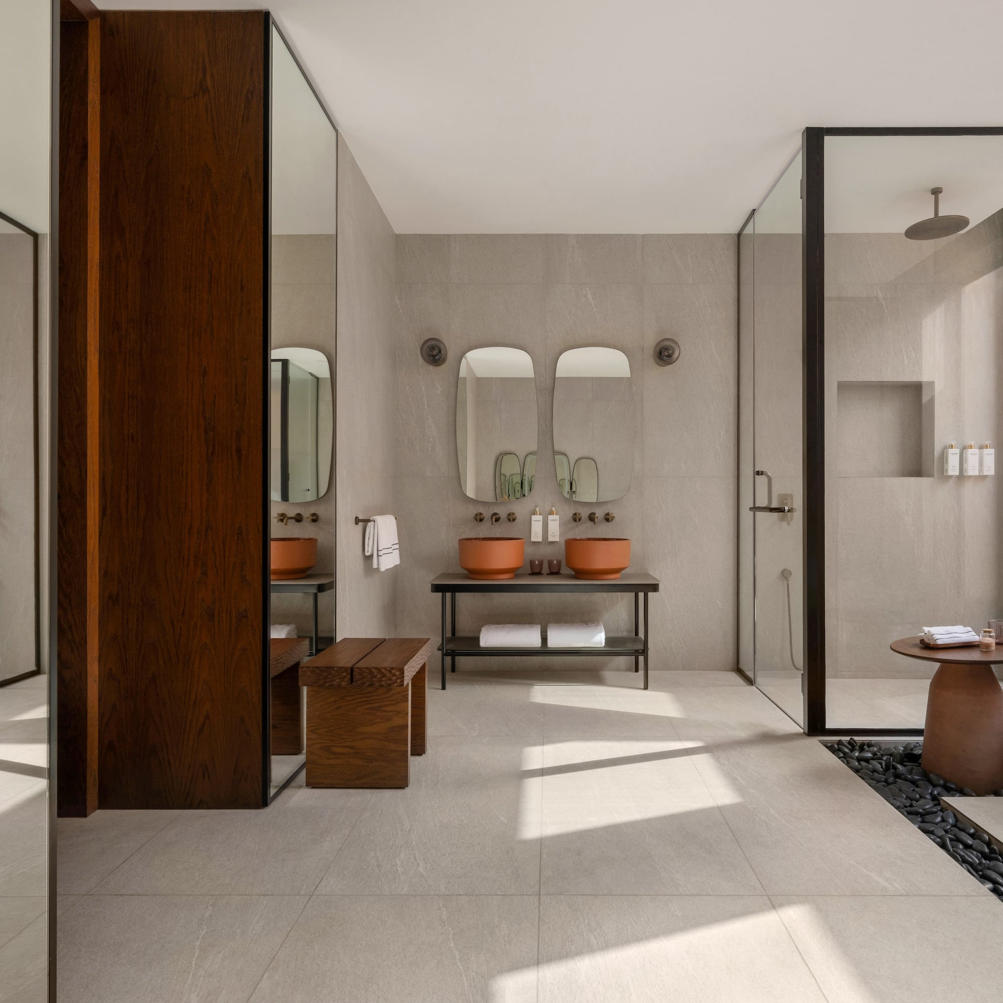 a bathroom with a stone floor and a stone table