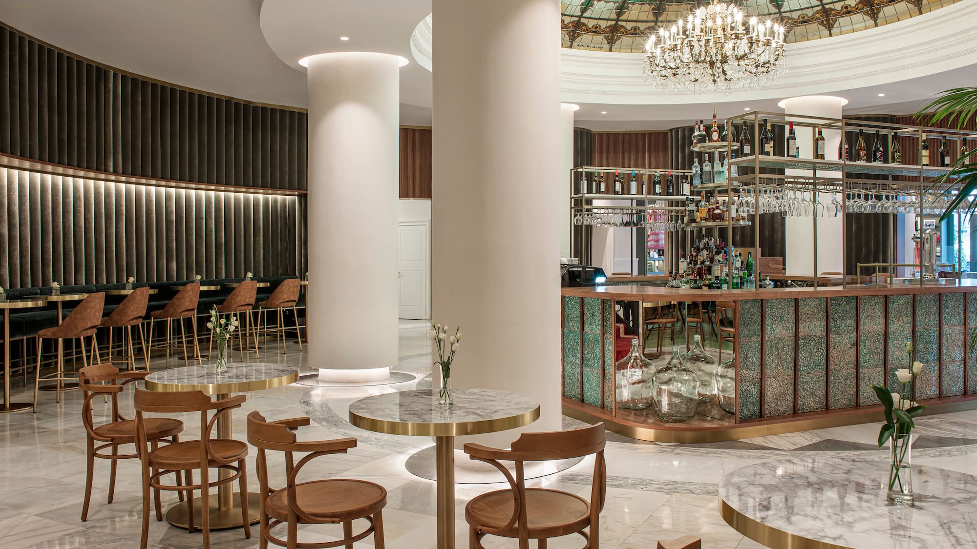 a room with a bar and tables