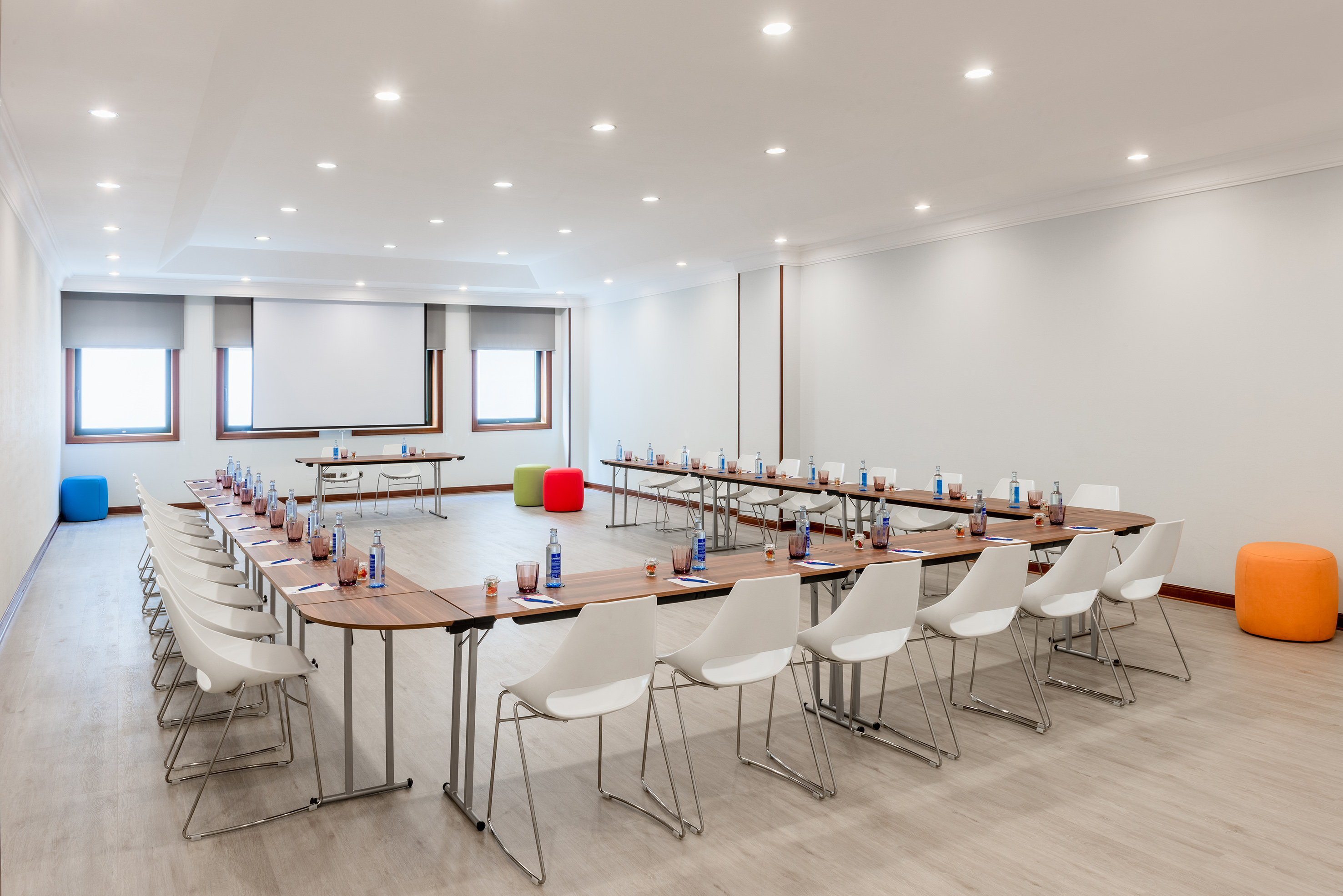 a room with a long table and chairs