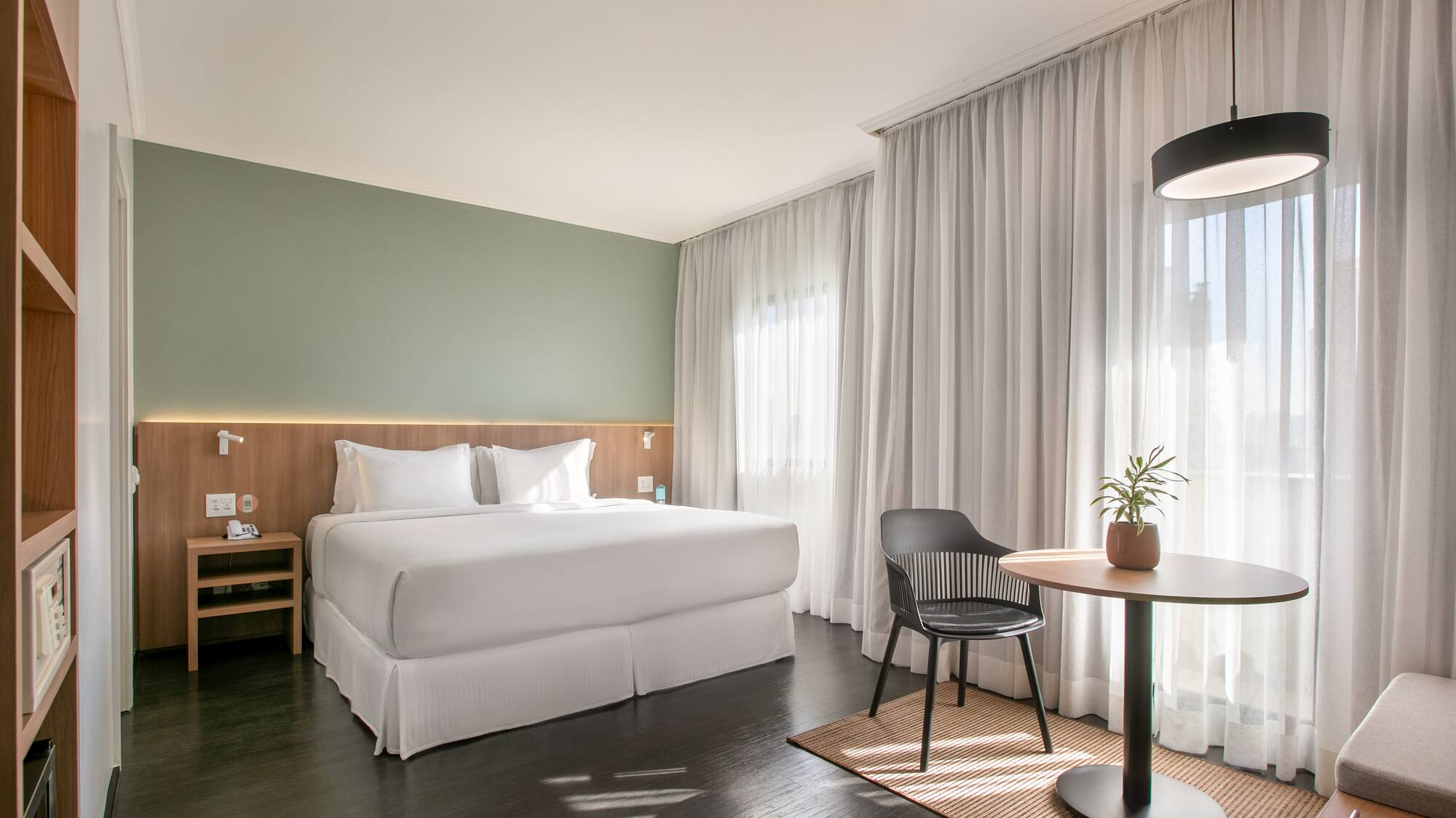 a room with a bed and a table