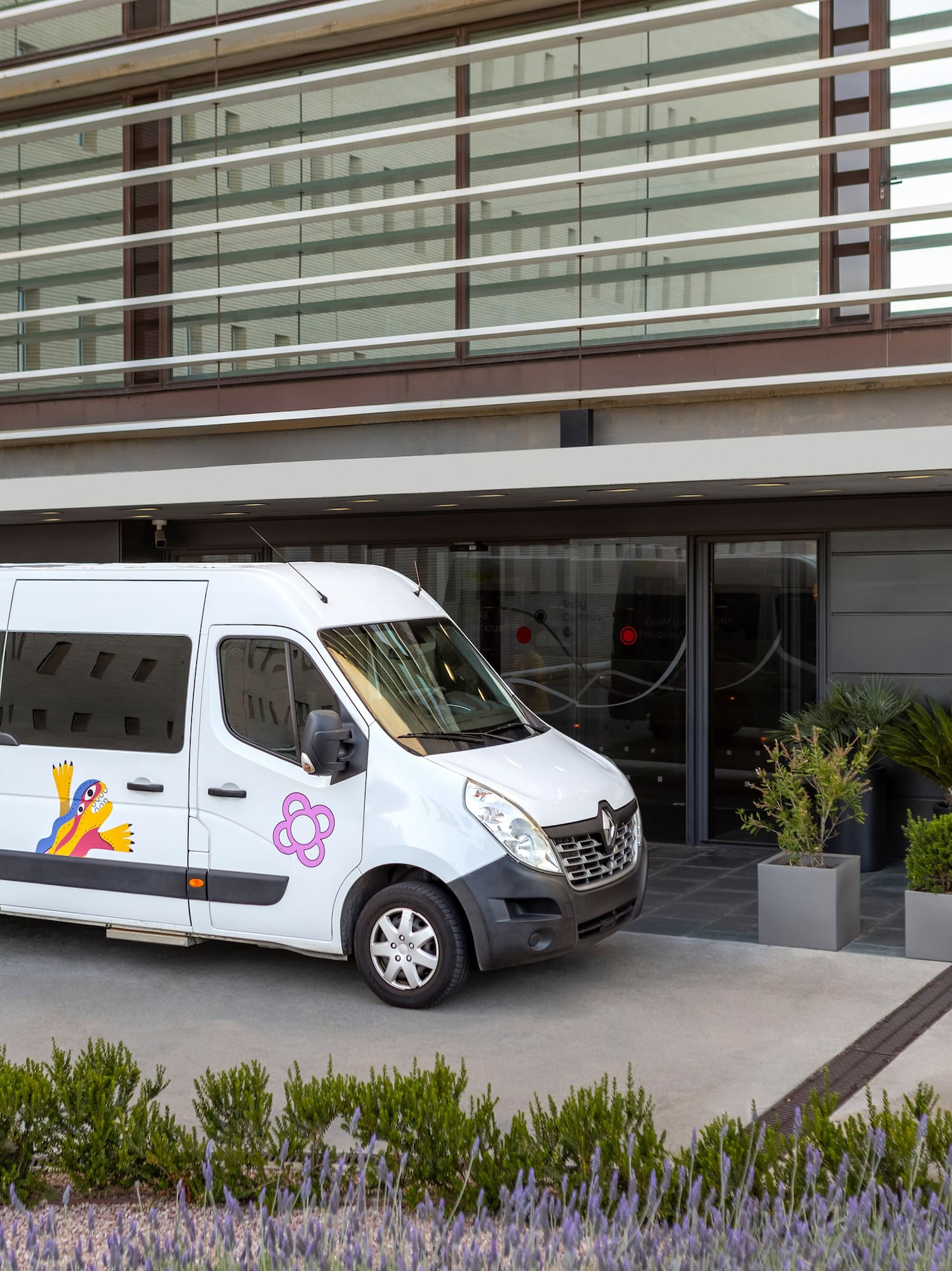 a white van parked outside of a building