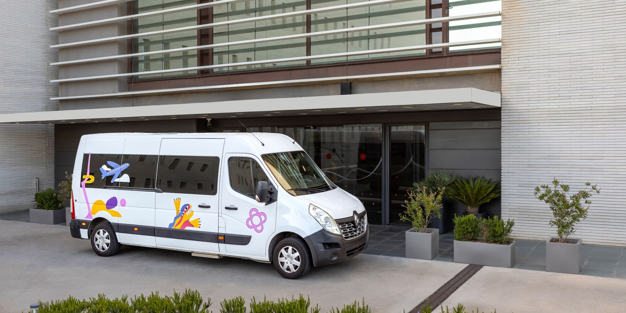 a white van parked outside of a building