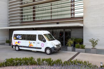 a white van parked outside of a building