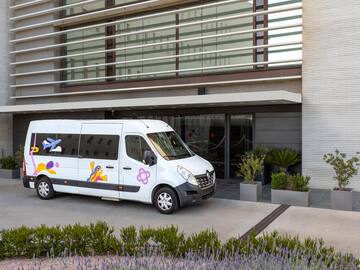 a white van parked outside of a building