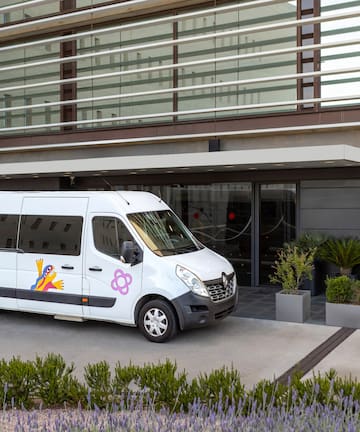 a white van parked outside of a building